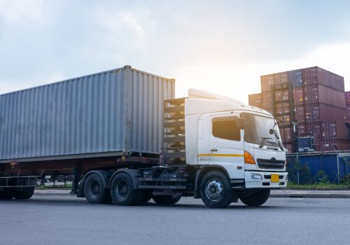 Container cargo truck in ship port Logistics.Transportation industry in port business concept.import,export logistic industrial Transporting Land transport freight warehouse storge