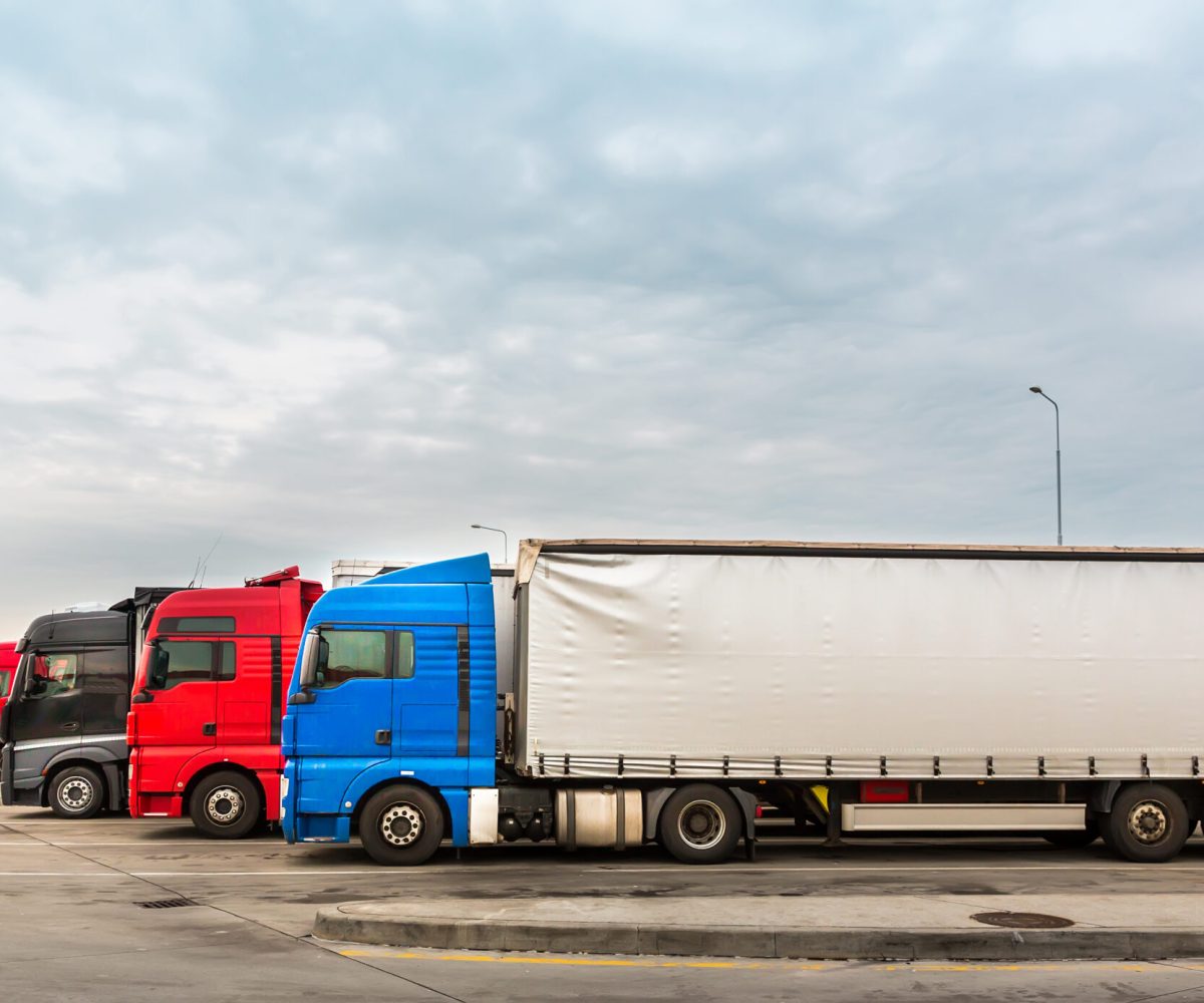 Trucks on parking, cargo transportation in European cities. Vehicles for for delivery of goods in Europe